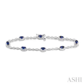 5x3MM Oval Cut Sapphire and 1/20 Ctw Single Cut Diamond Bracelet in 10K White Gold