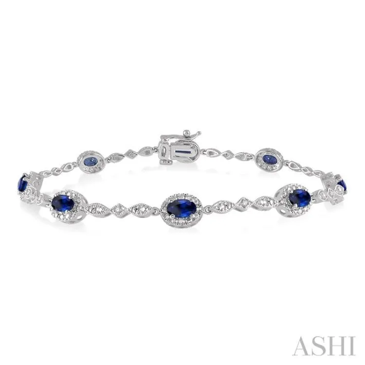 5x3MM Oval Cut Sapphire and 1/20 Ctw Single Cut Diamond Bracelet in 14K White Gold