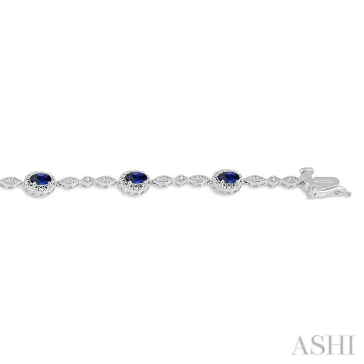 5x3MM Oval Cut Sapphire and 1/20 Ctw Single Cut Diamond Bracelet in 14K White Gold