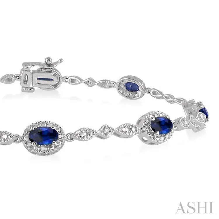 5x3MM Oval Cut Sapphire and 1/20 Ctw Single Cut Diamond Bracelet in 14K White Gold